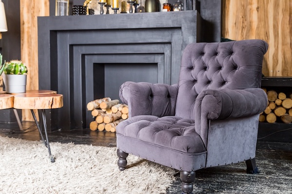 An elegant purple chenille armchair.