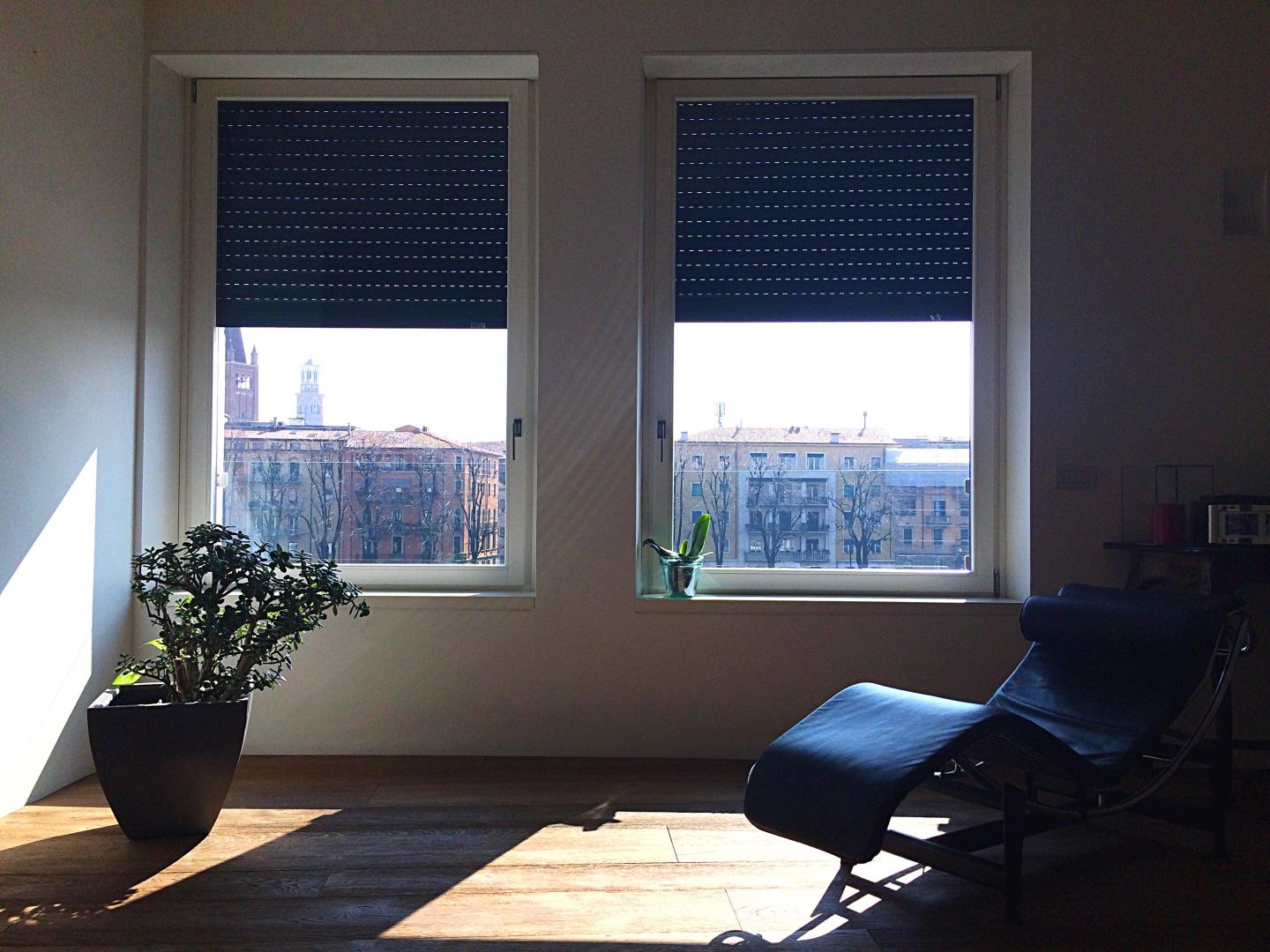 Two windows with inside mount shades.