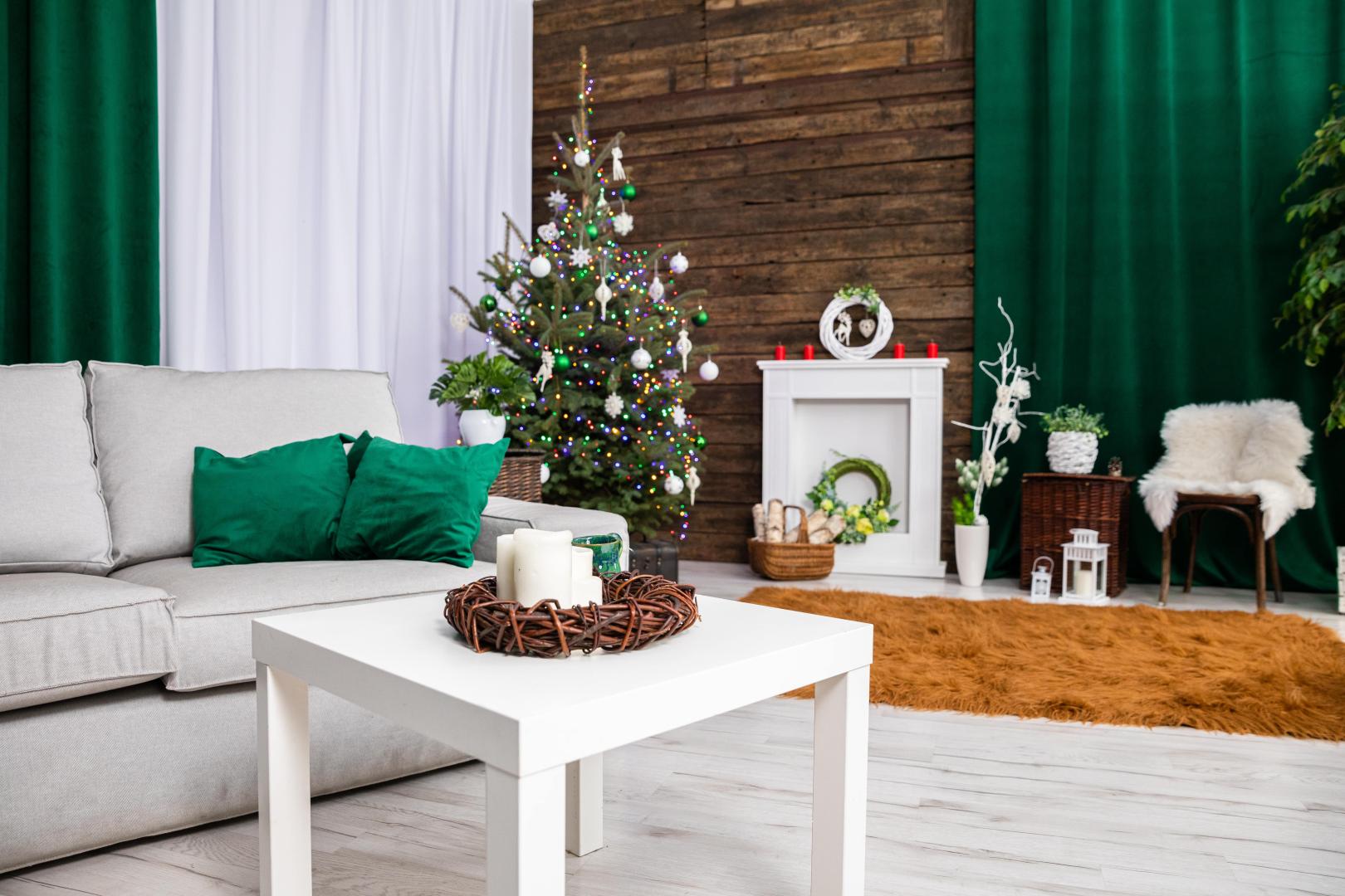 A living room decorated for Christmas with green thermal curtains.