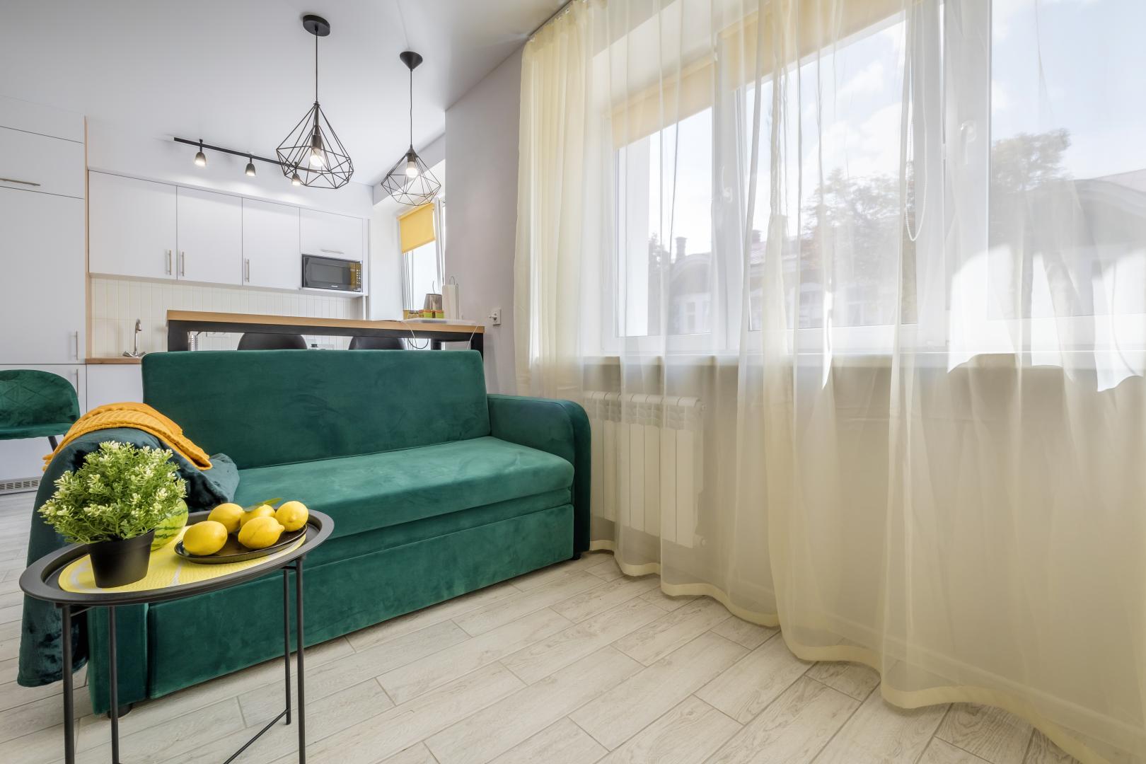 Living area with sheer curtains.