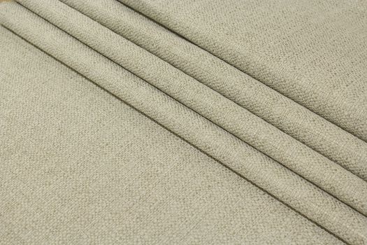 A close-up of a light gray textured linen fabric.