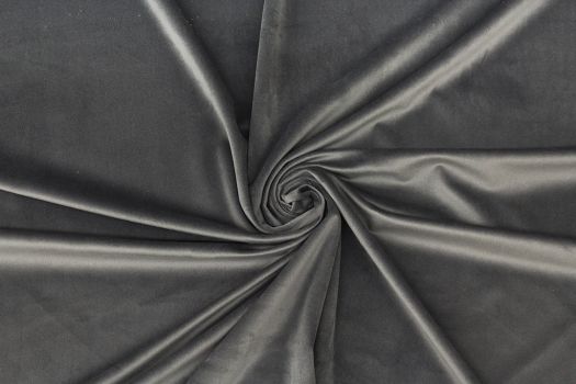 A close-up of a dark gray velvet fabric.