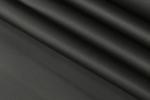 A close-up of a black vinyl coated fabric.