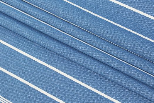 A close-up of a blue and white striped polypropylene fabric.