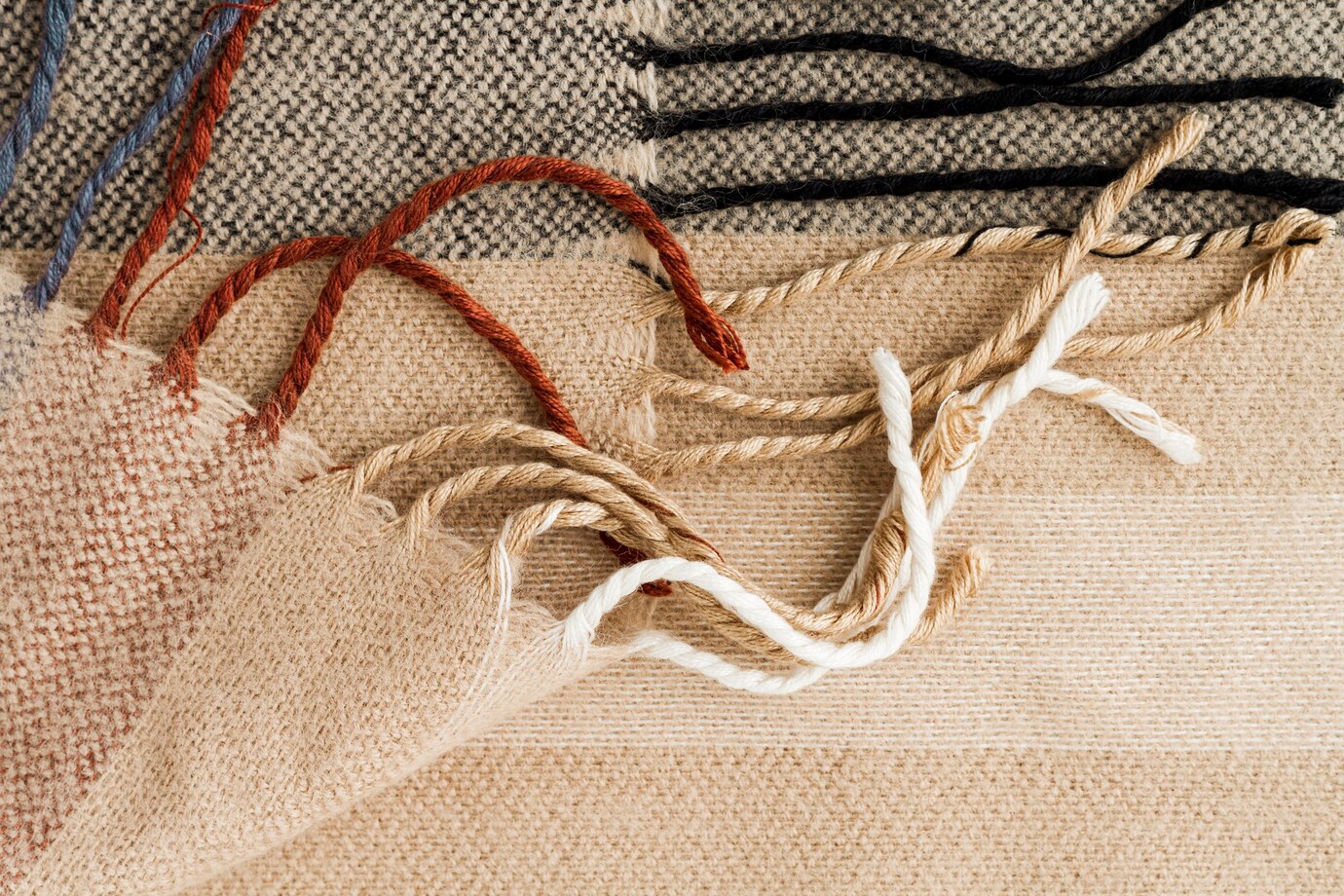 A close-up of a beige plaid acrylic fabric.
