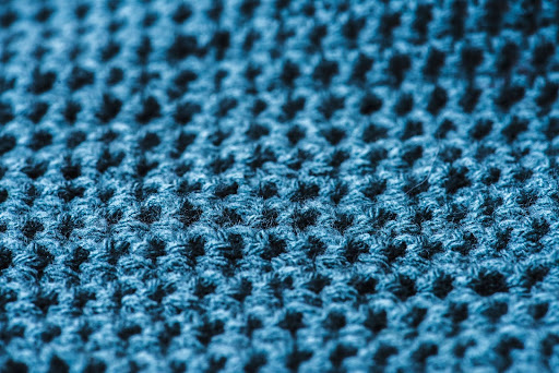 Close-up of a bright blue wool fabric.